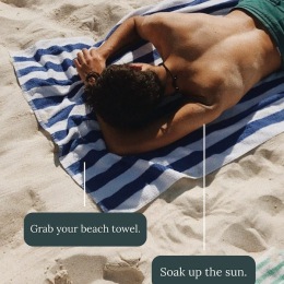 a man laying on a beach