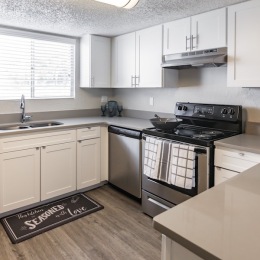 a kitchen with white cabinets