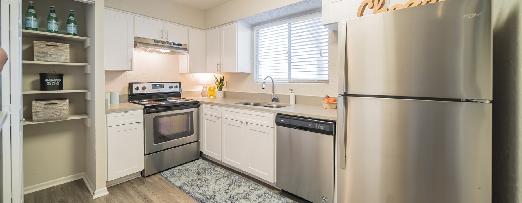 a kitchen with white cabinets