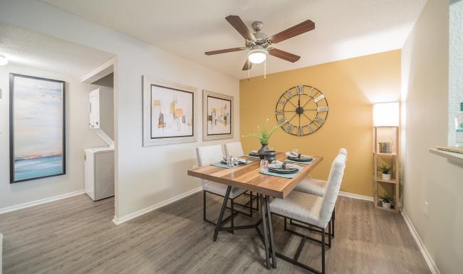 a dining room with a table and chairs